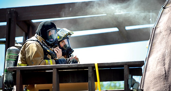 &lt;p&gt;Evergreen firefighters James Boyce, left, and Jared Pitcher put their masks on and prepare to enter a studio apartment fire on Harmony Road in Evergreen on Friday afternoon, August 3. No one was injured in the fire, but two dogs died probably due to smoke inhalation.&lt;/p&gt;