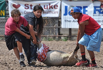 &lt;p&gt;Beau Jay Grant and Jaden and Eric Rodda haul their lamb over the finis line to win the over 12 sheep dressing contest.&lt;/p&gt;