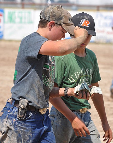 &lt;p&gt;Philip Vaughan and his friend discuss how to split their winnings from the pig scramble.&lt;/p&gt;