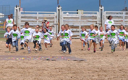 &lt;p&gt;Darling tots make a mad dash for a tarp covered with candy during the Kid Scramble&lt;/p&gt;