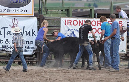 &lt;p&gt;Competitors got both kinds of green--money and manure--during the calf scramble.&lt;/p&gt;