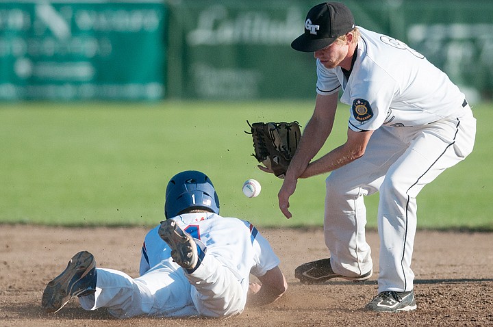 <p>Glacier Twins short stop Carl Talsma (8) mishandles a throw to second base on Billings Royals' Joseph Zimmer's steal from first Wednesday evening during the Class AA State Tournament at Memorial Field. Wednesday, Aug. 1, 2012 in Whitefish, Montana.</p>