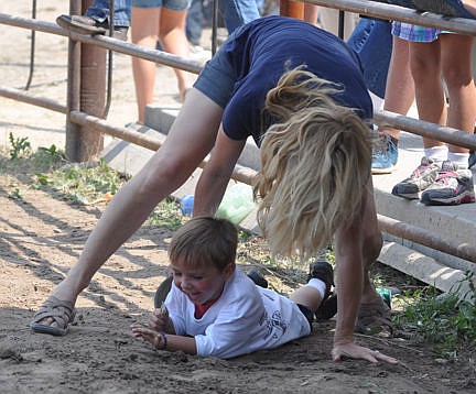 &lt;p&gt;Mom finally catches her boy who bounded away from the crowd when he figured he had gotten enough candy during the kid scramble.&lt;/p&gt;