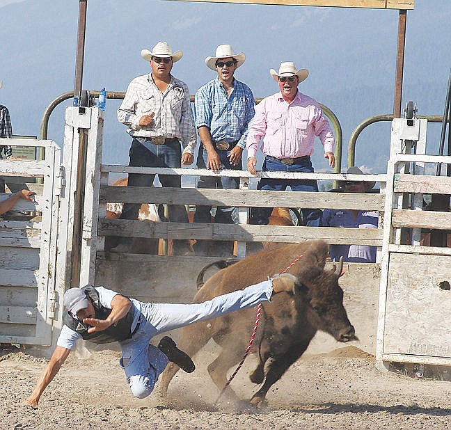 &lt;p&gt;Scott Lavell, the final rider of the day, kicks back at his wild buffalo after being bucked in 1.82 seconds.&lt;/p&gt;