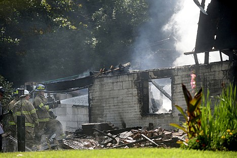 &lt;p&gt;Firefighters work at the scene where authorities say a twin-engine plane crashed into a house Saturday in Bell Township, Pa.&lt;/p&gt;