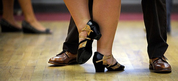 <p>Pete Milne and Lindsey Rosenberry dressed in head-to-toe vintage attire for the North End Swing dance featuring Company Brass July 20 in Kalispell. North End Swing hosts weekly dances at the senior center in Kalispell from 8 p.m. to midnight.</p>