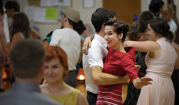 <p>Caitlin Hills dances with Levi Hoch July 20 at the North End Swing dance featuring their first live band, Company Brass. Hills and others added to the 1930s and '40s atmosphere of the evening by dressing in vintage clothing.</p>