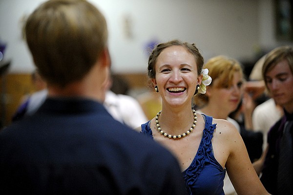 <p>Emilie Erler smiles as she dances July 20 at the North End Swing dance in Kalispell.</p>