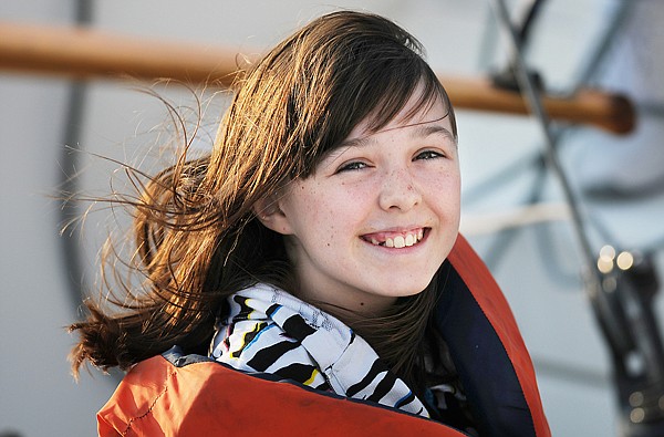 Darian Burns, 11, of Kalispell smiles as she rides on her grandfather, Doug Good's, boat Suenos on Tuesday night. Good of Columbia Falls said that the boat's name is dreams in Spanish.