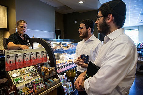 &lt;p&gt;Rabbis Berel Bendet, left, and Levi Dubov order coffee at Starbucks Coffee on Government Way in Coeur d&#146;Alene. Bendet and Dubov are traveling through Idaho as part of &#145;The Roving Rabbi&#146; program to meet with members of the Jewish community.&lt;/p&gt;