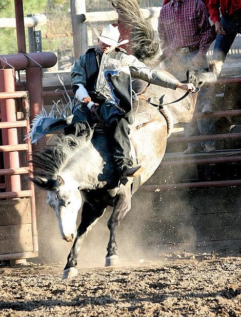 Nick Ianniello/Mineral Independent Andy Bolich from Belgrade scores a 77 in the bareback bucking bronco event at the Superior Lions Club Rodeo Friday night.