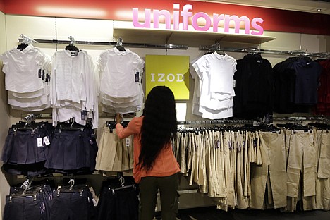 &lt;p&gt;In this July 31, 2013, photo, school uniforms by Izod are displayed at JC Penney in New York. Shoppers, worried about their finances, showed they were more interested in buying discounted summer merchandise in July than in picking up new fall clothing for their children, according to figures released Thursday.&lt;/p&gt;