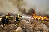 California wildfire destroys 26 homes