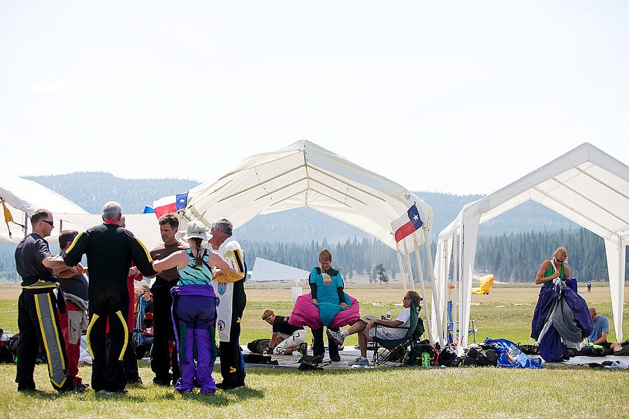 <p>Jumpers repack parachutes and practice formations Thursday afternoon during the 47th annual Lost Prairie Boogie. Aug. 7, 2014 in Marion, Montana. (Patrick Cote/Daily Inter Lake)</p>