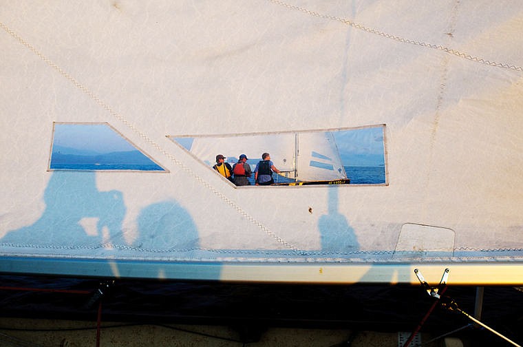 <p>Thistle class sail boats race side by side Tuesday evening during a North Flathead Yacht Club Del's Tuesday night series sailing race. July 30, 2013 in Somers, Montana. (Patrick Cote/Daily Inter Lake)</p>