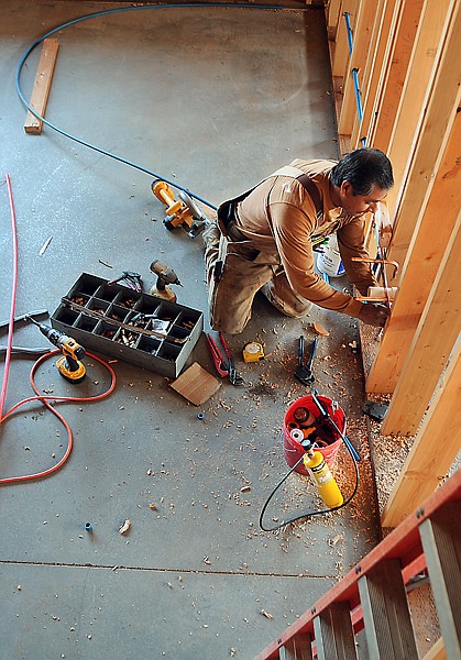 &lt;p&gt;Joe Hermosillo installs plumbing for the new classrooms at
Fair-Mont-Egan School.&lt;/p&gt;