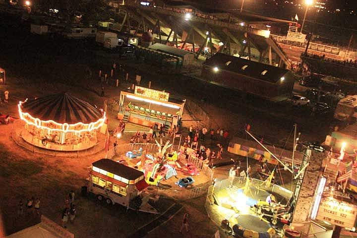 Fair goers enjoy the carnival during a past Grant County Fair. The 2014 fair starts Tuesday.