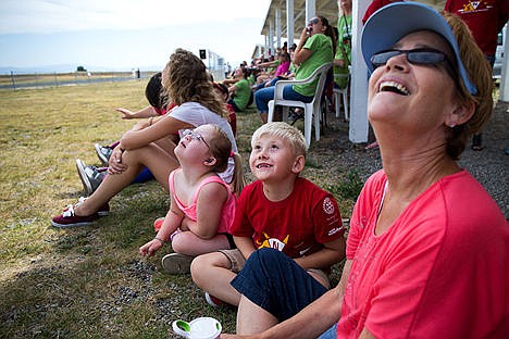 &lt;p&gt;Pam Mitchell, right, Skylar Andersen, 7,&#160;and Maddie Reed, 7,&#160;from Special Needs Recreation watch the model plane airplane show presented by the Coeur d'Alene Aero-Modeling Society (CAMS).&lt;/p&gt;