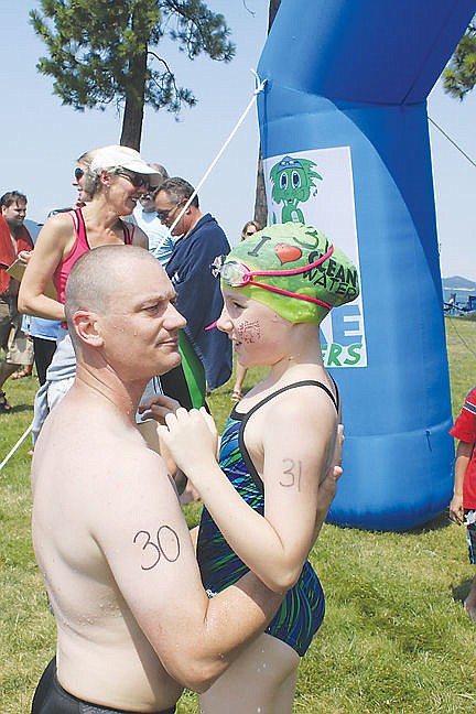 &lt;p&gt;Lake Monsters swimmer Hannah Simpson hugs her father and discusses strategy after the two finished the race concurrently. Hannah, eight, is the youngest person to ever compete in the mile-long open-water swim that makes up Polson's Water Daze.&lt;/p&gt;