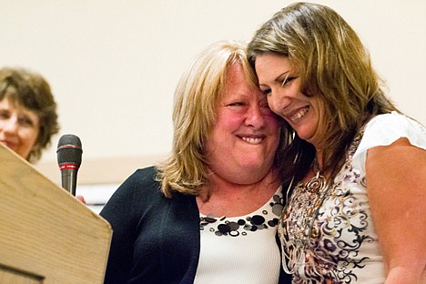 &lt;p&gt;Caryl Johnston, executive director of United Way of Kootenai County, hugs Linda Holehan Thursday after announcing Holehan as the Live United 2012 Volunteer Extraordinaire during the United Way Campaign Celebration and Awards Luncheon in Coeur d'Alene.&lt;/p&gt;