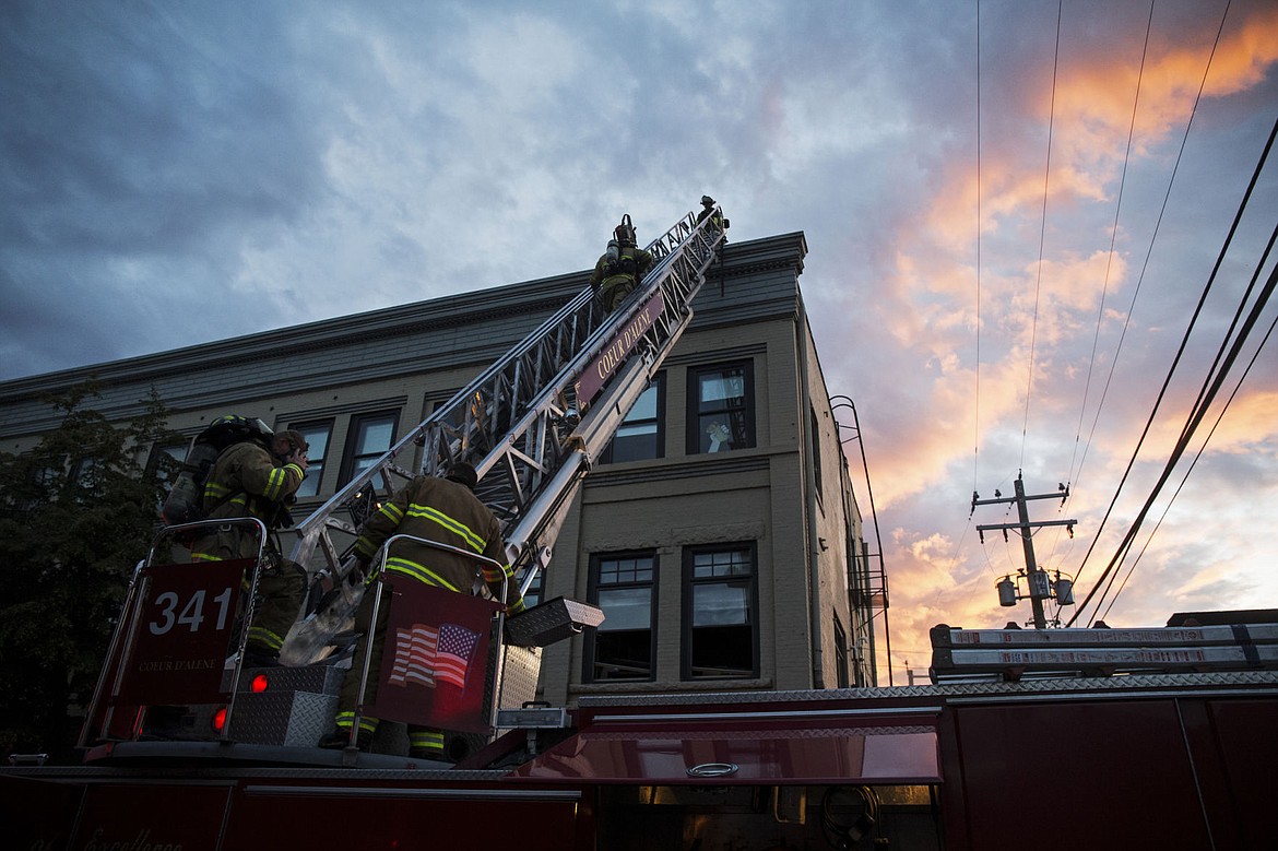 &lt;p&gt;Firefighters work to contain smoke from a three-alarm fire in a three-story building at 325 Sherman Avenue in downtown Coeur d'Alene.&#160; Occupants were successfully evacuated from the building. The cause of the fire is under investigation.&lt;/p&gt;