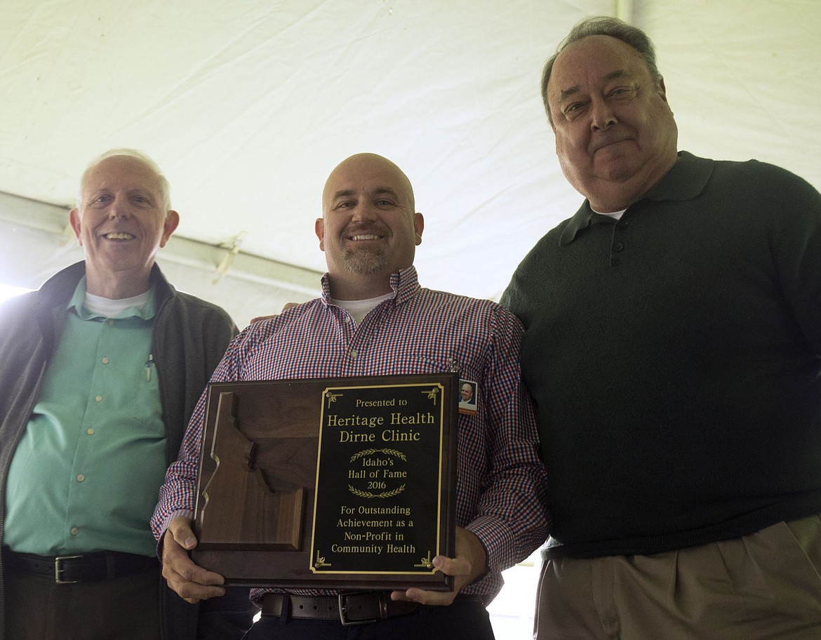 &lt;p&gt;Heritage Health CEO Mike Baker, center, holds a plaque commemorating the clinic's induction into the Idaho Hall of Fame as he&#146;s flanked by Idaho Hall of Fame board members Tony Stewart, left, and Freeman Duncan.&lt;/p&gt;