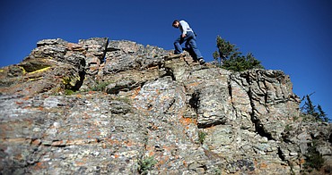 <p>Gavin Lommatsch of Columbia Falls makes his way along Scenic Point Trail on Sunday, July 29, in East Glacier.</p>