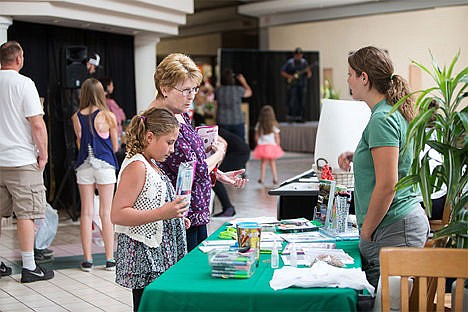 &lt;p&gt;Shirley Petersen and her granddaughter Sidney Johnson, 10 visit with Jennifer Young at a Girl Scout information table Saturday at Silver Lake Mall for the Back to School Fair.&lt;/p&gt;