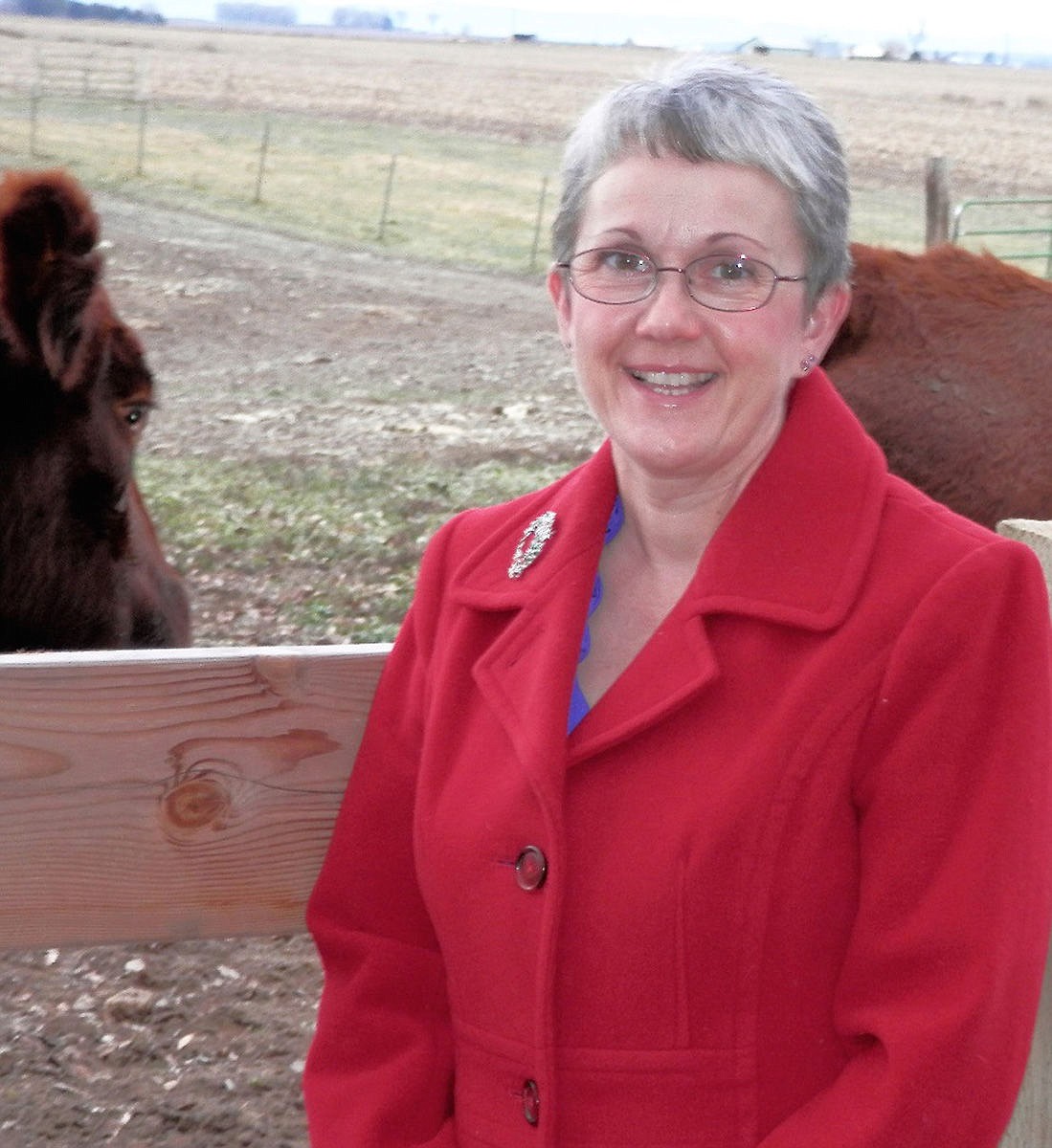 This picture was taken for a calendar for Alice&#146;s in-laws. She and Michael needed pictures that represented their life. This picture represents her early life and the fact the neighbor&#146;s cows &#147;stand there and watch everything&#148; they do.