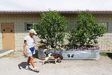 &lt;p&gt;Mary Duval, of Hayden, walks dogs Thursday at the Kootenai Humane Society. The organization is preparing for its upcoming fundraiser, Tails at Twilight.&lt;/p&gt;