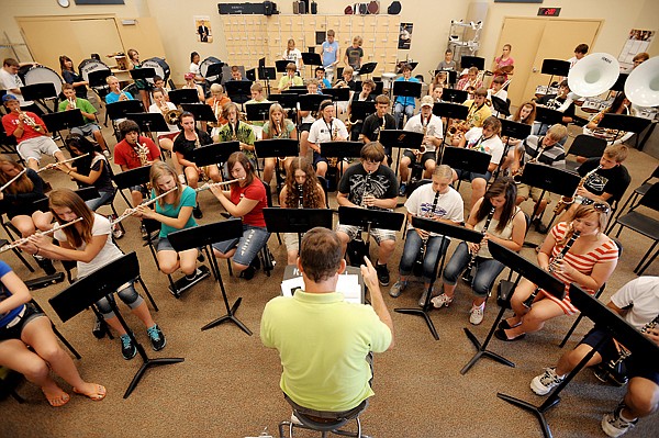 <p>David Barr works with students on Tuesday, August 7, at the Glacier High School Band Camp.</p>
