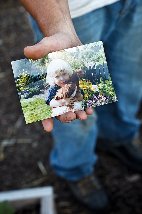 &lt;p&gt;SHAWN GUST/Press Brian Partington shares a photo of his son Keegan that he feels help convince Post Falls City Council members to take a look at chicken laws within city limits.&lt;/p&gt;