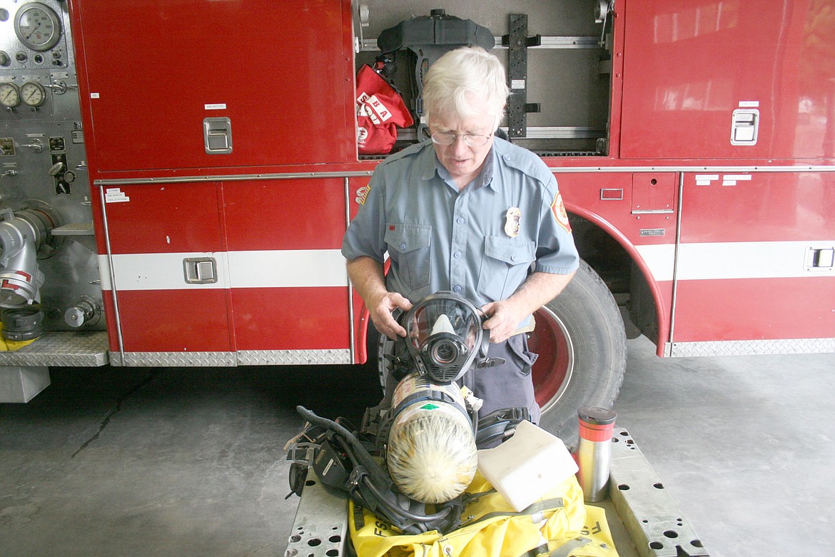 &lt;p&gt;SVFD Chief John Woodland displays the old gear which will be replaced with much safe self-contained-breathing-apparatuses.&lt;/p&gt;