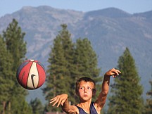 Phillip Malatare, of Arlee, passes the ball during Midnight Hoopz at Two Eagle River high school last Thursday in Pablo.