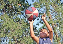 Alex Moran, of Arlee, takes a shot during Midnight Hoopz last weekend at Two Eagle River High School last Thursday in Pablo.