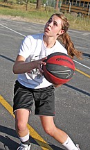 14-year-old Alexis Shick, of Arlee, gets ready to take a shot during Midnight Hoopz last Thursday at Two Eagle River High School in Pablo.