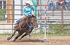 Skyler Frame, of Charlo, turns the corner while pole bending during the Southwest Youth Rodeo last Sunday in Ronan.