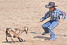 Garrett Croft, of Polson, chases down a goat during the goat tying event of the Southwest Youth Rodeo last Sunday in Ronan.