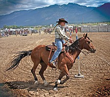 Jo Lien, of Ronan, rounds the last pole during the pole-bending event of the Southwest Youth Rodeo last Sunday in Ronan.