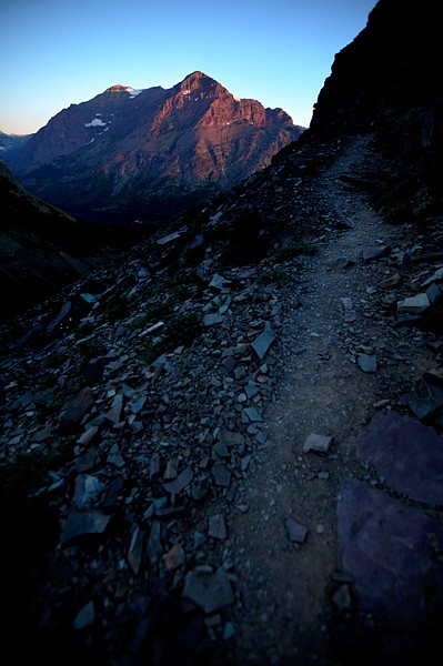 <p>View of Scenic Point Trail as the first rays of sunrise begin to light the mountains of East Glacier on Sunday, July 29. The trail is 6.2 miles out-and-back with an elevation gain of 2350 feet.</p>