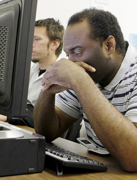 &lt;p&gt;In this July 20 photo, a dejected Orlando Payton looks for a job on the computer at JobTrain employment office in Menlo Park, Calif.&lt;/p&gt;