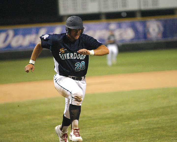 Drew Loera races toward home plate during the River Dogs' game against the Falcons.