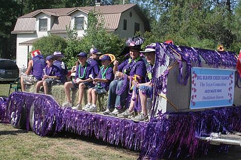 Jamie Doran/Valley Press The Beaver Creek Ranch displayed their purple proudly at the 29th Annual Huckleberry Festival Saturday. The Beaver Creek Ranch won second place for Best Commercial Float in the parade. The festival took place last Friday, Saturday and Sunday and attracted roughly 3,500 visitors from all over, according to Liz Cintrino, the chair of the Huckleberry Festival. This year&#146;s festivities included a karaoke sing-a-long on Friday night and a Jam and Jelly competition Saturday along with the traditional arts, crafs and demonstrations.