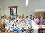 Seniors warm community with quilts