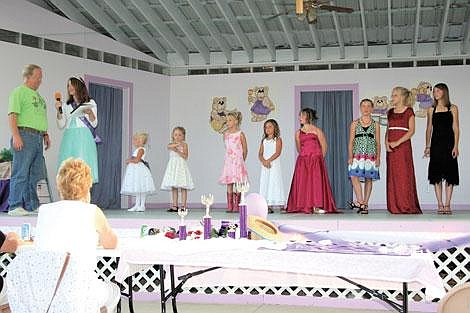 Symona Wood/Sky High Photography Ashley Wiltse, far left, organizer of the Miss Huckleberry Pageant, stands with the contestants, from left: Faith Frields, Hailey Carpender, Sarah Wood, Kaydra Brown, Samantha Arrants, Naomie Rummel, Andrea Wood, and McKinley Williams.