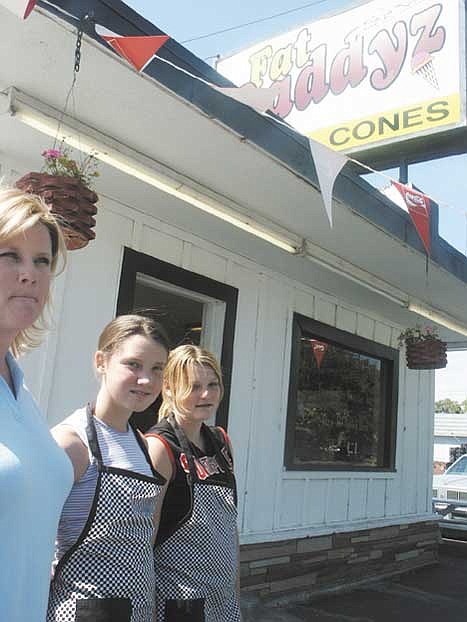 PHOTOS: 1-3. Fat Daddyz owner Michele Cram and her daughters Courtney and Katrina stand outside their new place of business Thursday afternoon.<br>4. Fat Daddyz owner Michele Cram talks business with her daughters Courtney and Katrina Thursday afternoon.<br>5. Fat Daddyz employees and managerial daughters Courtney and Katrina Cram contemplate what to do next upon opening their business to the public for the day Thursday afternoon.