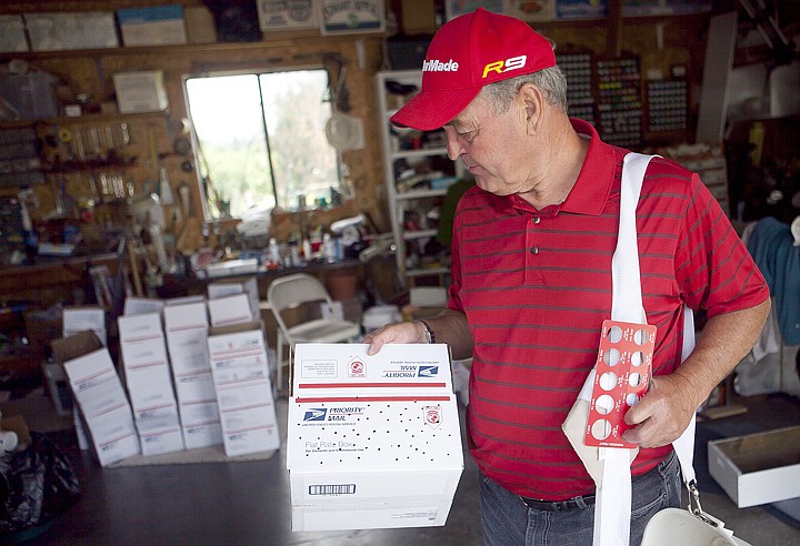 &lt;p&gt;Gary Hoover, owner of Gary's Cherries, pokes holes in the boxes
he uses to ship his cherries. Hoover sends cherries to customers
all across the United States.&lt;/p&gt;