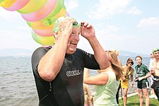 President of the MVA board of directors, Hugh Beaver, finishes the one-mile swim smiling from his six minute improvement over last year's race.