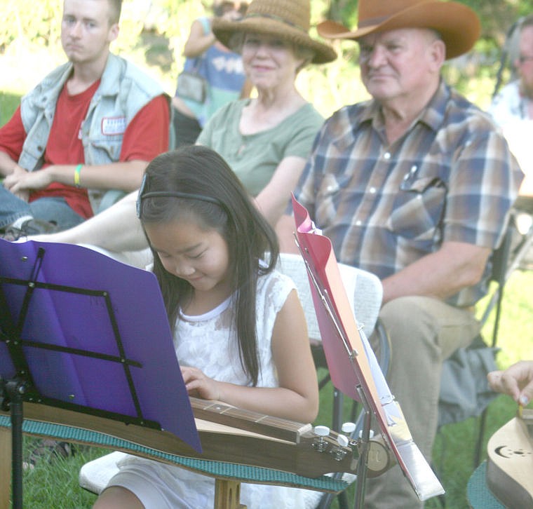 &lt;p&gt;Mya Zeiler plays the mountain dulcimer as the audience looks on. Zeiler was playing with a group that included her grandfather John Meckler as well as Leena and Ashlynn Meckler.&lt;/p&gt;