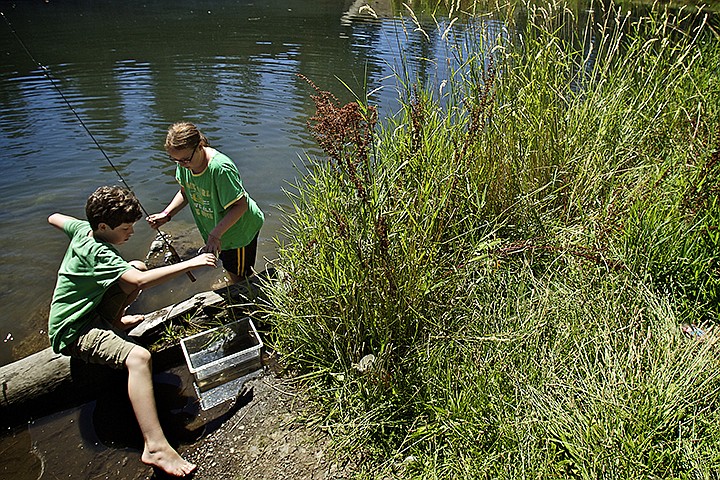 &lt;p&gt;JEROME A. POLLOS/Press Noah Reynolds, 13, left, and Savannah Carr, 11, finish their fishing trip Friday at Falls Park and gather their things to meet up with the rest of their group Friday. About 20 children who took part in the Watchable Wildlife Camp, held in cooperation with the Idaho Department of Fish and Game, took part in the fishing trip to Falls Park's pond.&lt;/p&gt;